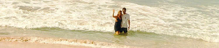 Mike and Janet waving from the surt at Cane Garden Bay