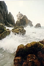 Surf crashing against rocks