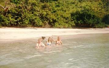 Cheryl, Darla and Janet drink in the surf