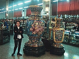Mei our tour escort in the Cloisonne showroom, Beijing