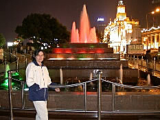 Anne with a fountain in the background, Shanghai