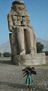 Little boy with black sheep at Colossi of Memnon