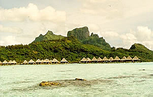 Different views of Bora Bora's mountains with overwater huts