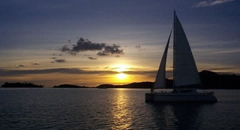 Sailboat with the setting Sun in the background